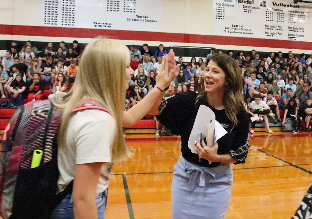HHS Principal Amanda Munson high-fives a freshman